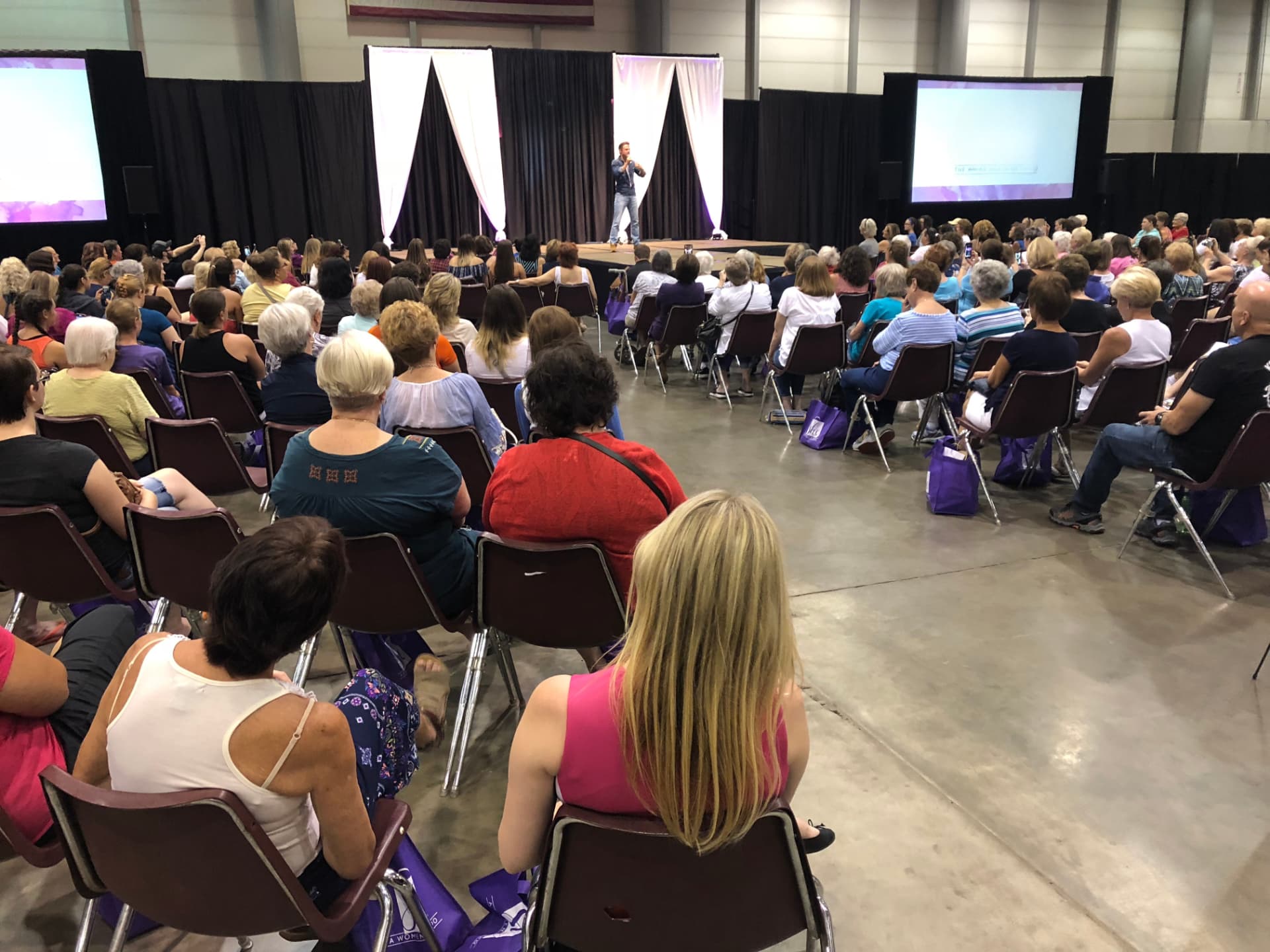 An audience watching a keynote speaker