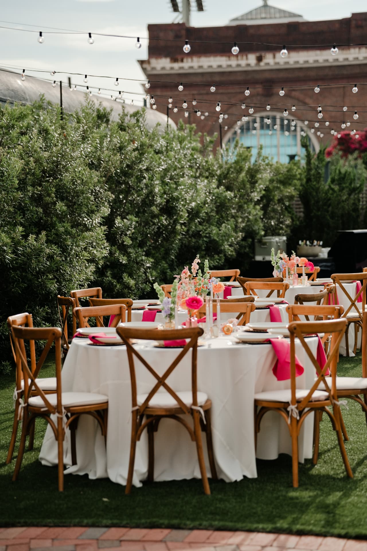 Rounds set for dinner in a garden courtyard