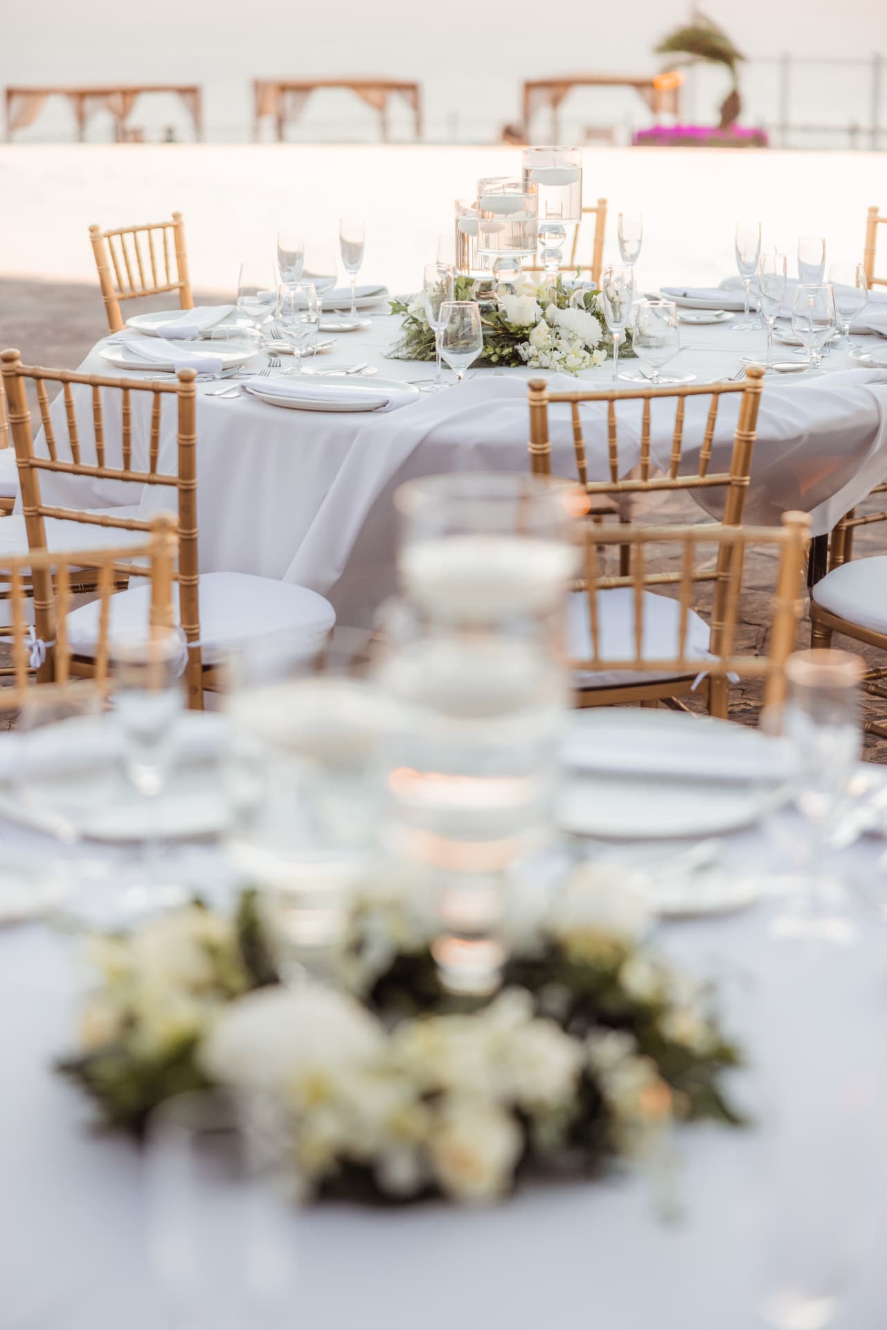 Beachside dinner tables at golden hour