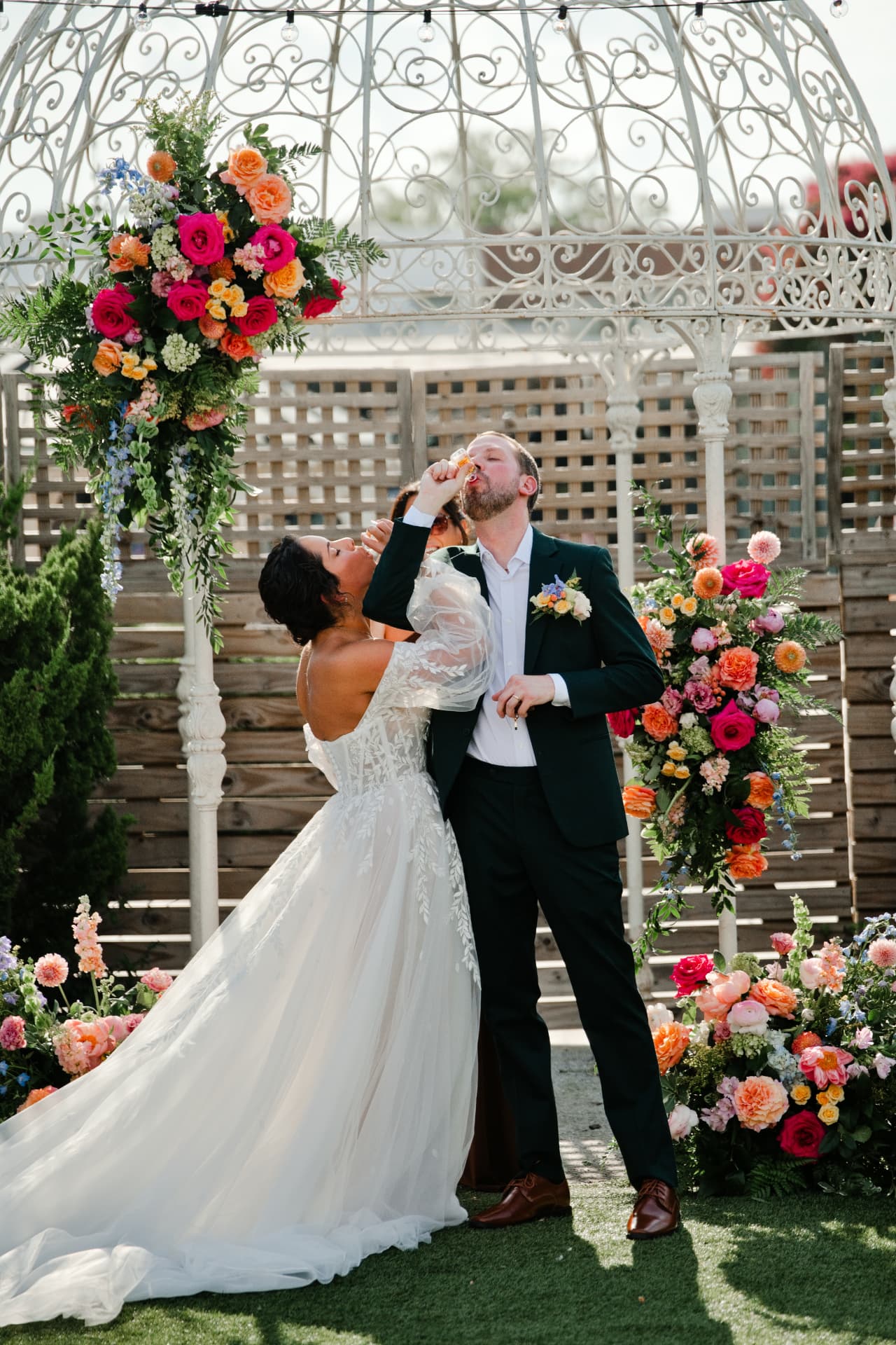 A couple beneath a floral arbor