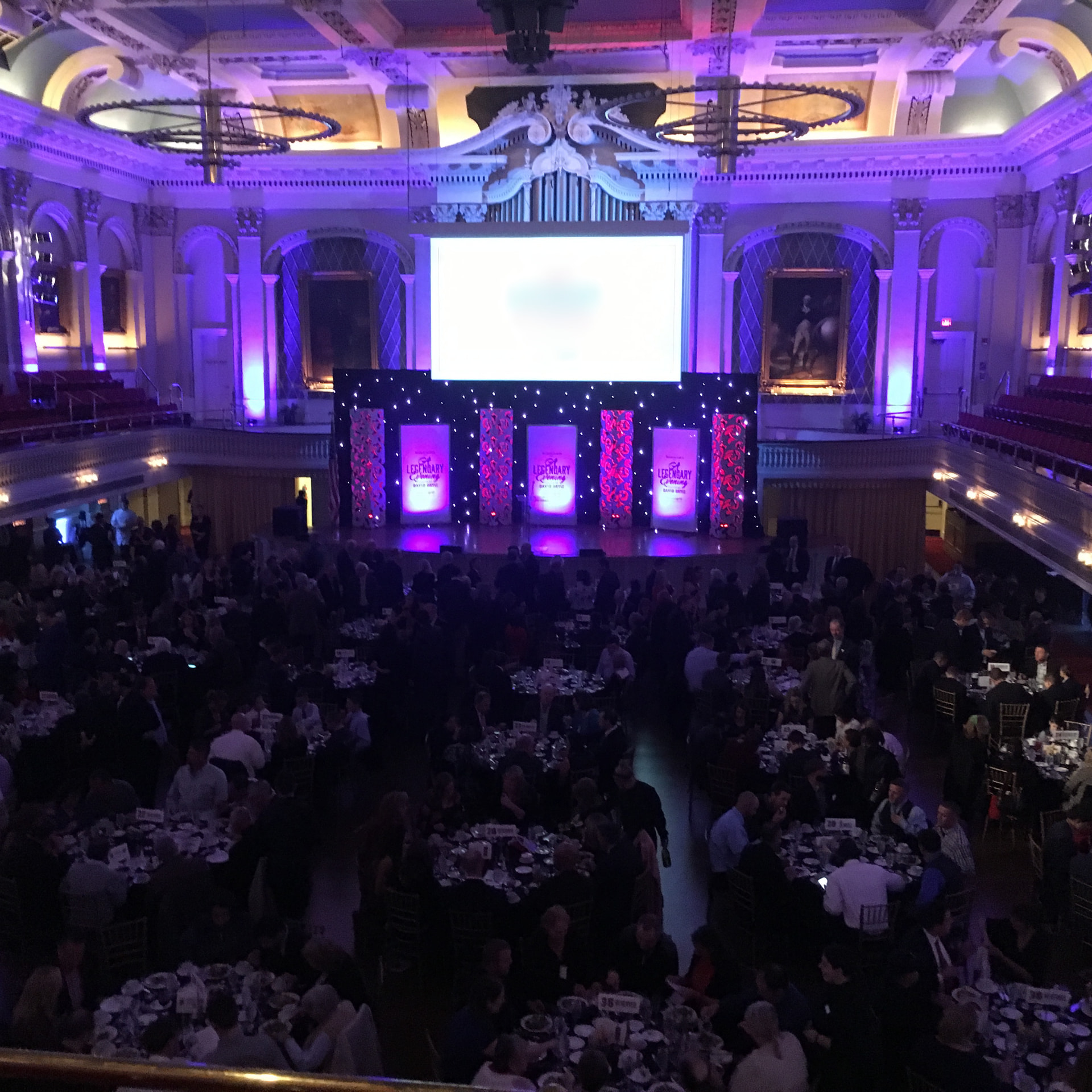A banquet hall set for a large event