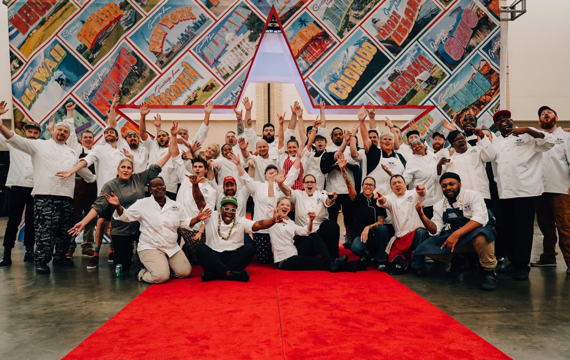 A group celebrating on a red carpet